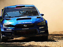 A subaru car running in a rally cross